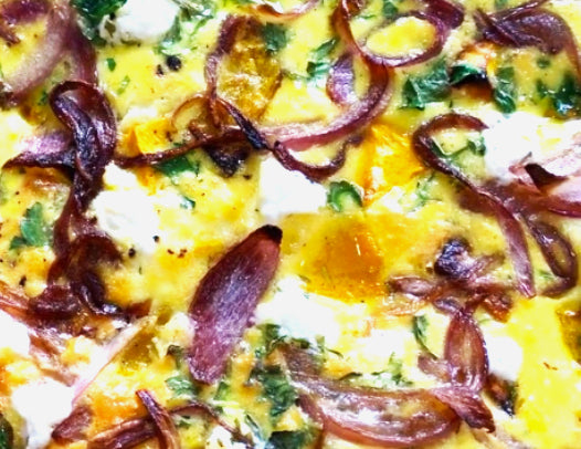 Oven baked roasted pumpkin frittata, topped with caramelised onion